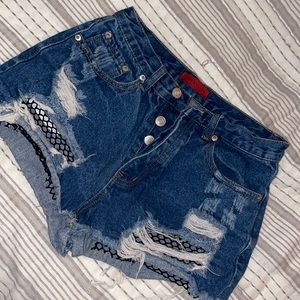 ripped fish net jean shorts